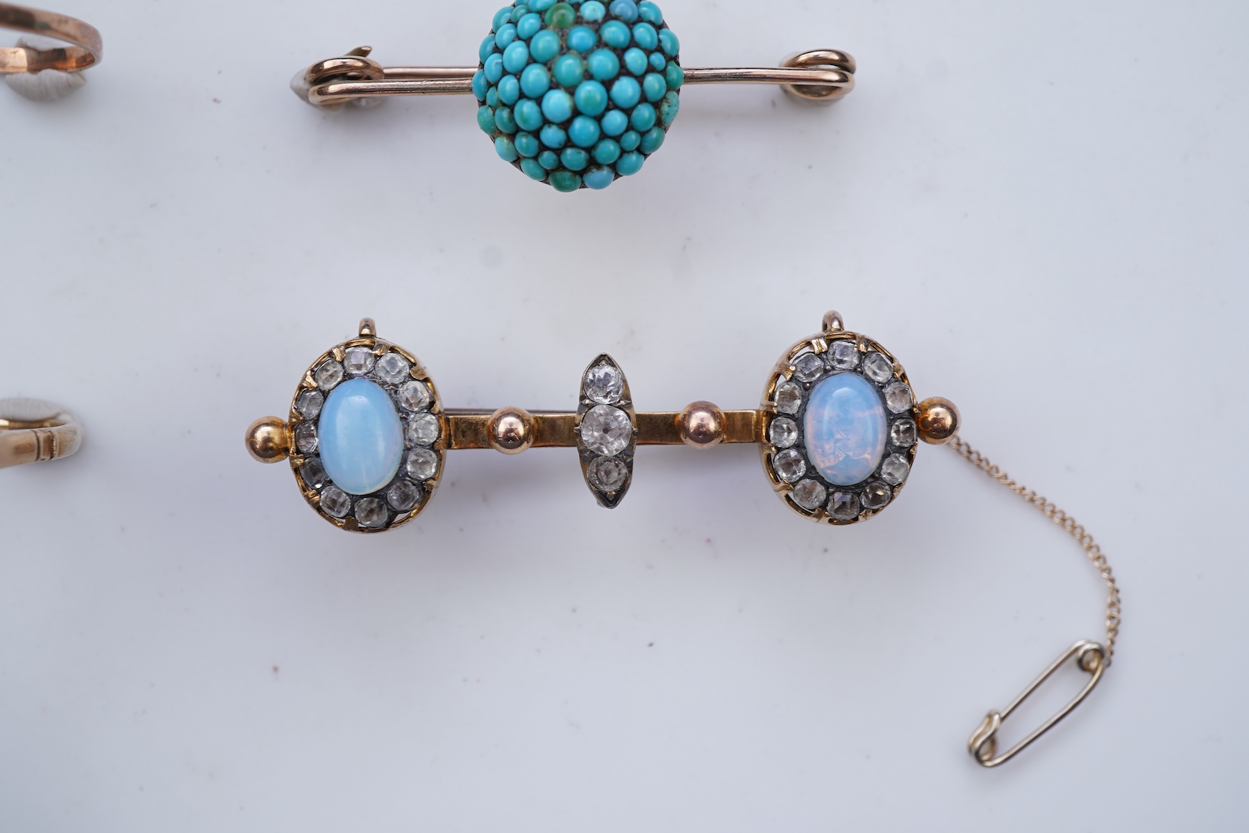Three rings and a brooch
